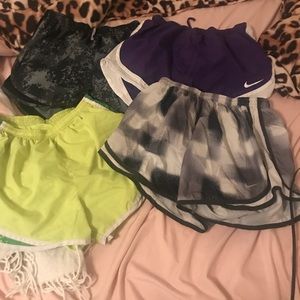 Four pairs of M Nike tempo shorts